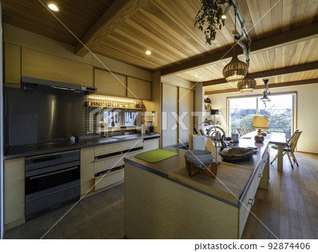 The kitchen dining area is bathed in soft sunlight 92874406