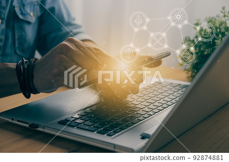 Casual Businessman Touching Mobile Phone Screen and Cryptocurrency Symbol in Vintage Tone 92874881