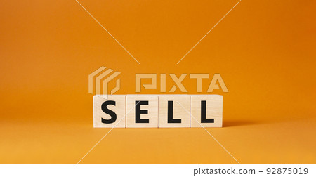 Sell symbol. Concept word Sell on wooden cubes. Beautiful orange background. Business and Sell concept. Copy space. 92875019
