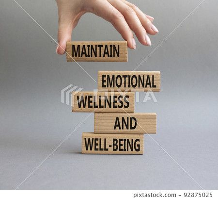 Wellness and Well-being symbol. Wooden blocks with words Maintain emotional Wellness and Well-being. Beautiful grey background. Businessman hand. Copy space Wellness and Well-being symbol. Wooden blocks with words Maintain emotional Wellness and Well-being. Beautiful grey background. Businessman hand. Copy space 92875025