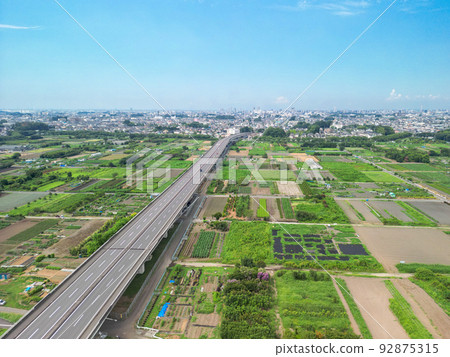 Aerial view "Saitama Prefecture" Minuma rice field and urban area/summer scenery Aerial view "Saitama Prefecture" Minuma rice field and urban area/summer scenery 92875315