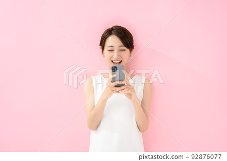 Female smartphone pink back Female smartphone pink back 92876077