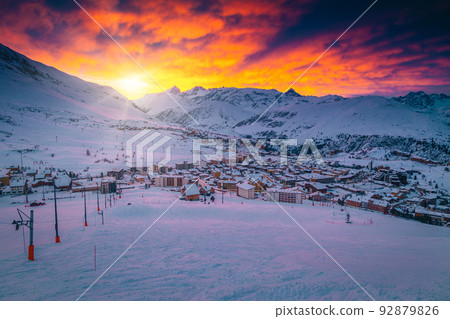 Colorful clouds over the ski resort at sunrise, France Colorful clouds over the ski resort at sunrise, France 92879826