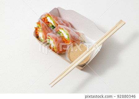 Vegan and tasty in paper package with chopsticks 92880346