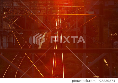Sunset light, railroad tracks and wires Sunset light, railroad tracks and wires 92880873
