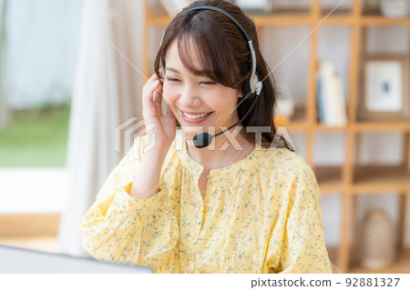 Young female operator working from home Young female operator working from home 92881327