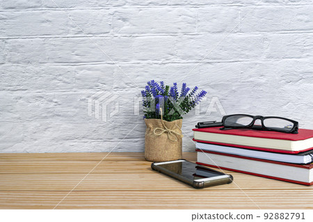 Office desk with supplies and wooden background. Copy space. Office desk with supplies and wooden background. Copy space. 92882791