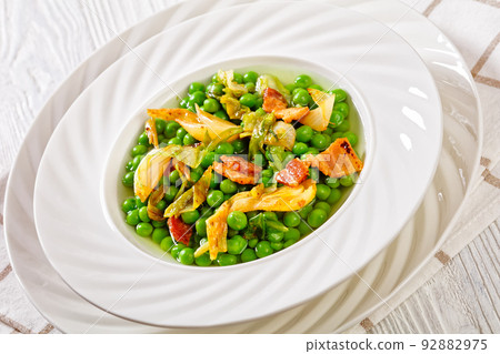 petits pois, french dish of garden green peas 92882975