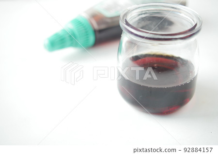 maple syrup in a glass jar on white maple syrup in a glass jar on white 92884157