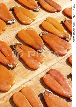 Close-up of drying mullet roe at Lukang Old Street in Changhua, Taiwan. Close-up of drying mullet roe at Lukang Old Street in Changhua, Taiwan. 92887367
