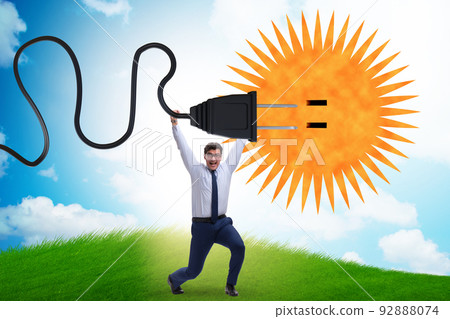 Businessman in solar energy concept 92888074