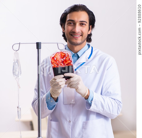 Young male doctor in blood transfusion concept Young male doctor in blood transfusion concept 92888610