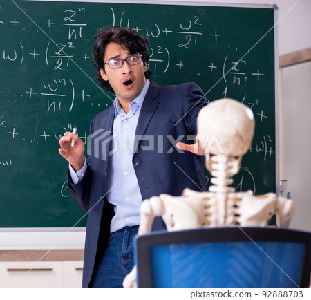 Young male math teacher and student skeleton 92888703