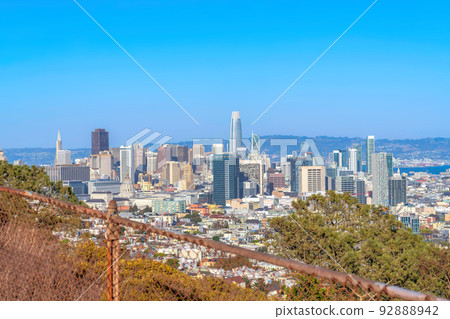 View from above of skyscraper buildings in the middle of midrise buildings in San Francisco, CA 92888942
