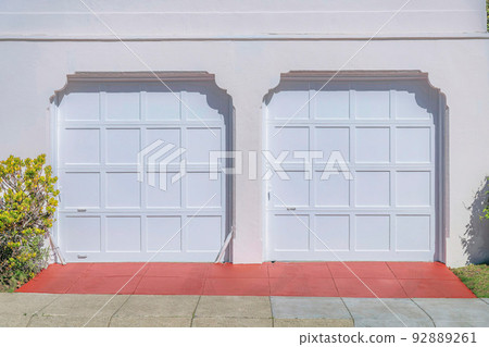 Two white sectional garage doors with clipped entrance- San Francisco, California Two white sectional garage doors with clipped entrance- San Francisco, California 92889261