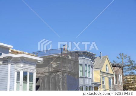 Unfinished house construction in the middle of residential house buildings in San Francisco, CA Unfinished house construction in the middle of residential house buildings in San Francisco, CA 92889488