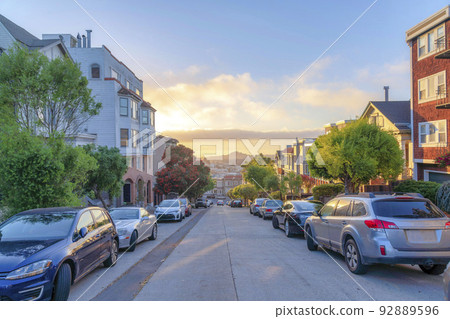 Straight concrete road with a view of the sunset sky in San Francisco, California Straight concrete road with a view of the sunset sky in San Francisco, California 92889596