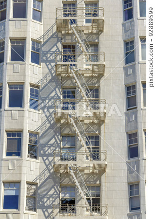 Emergency stairs in the middle of bay windows of a tall apartment building at San Francisco, CA Emergency stairs in the middle of bay windows of a tall apartment building at San Francisco, CA 92889599