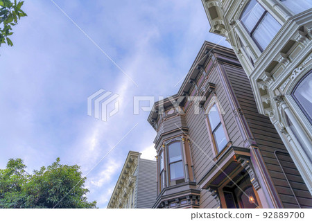 Victorian style townhouse buildings in a low angle view in San Francisco, California Victorian style townhouse buildings in a low angle view in San Francisco, California 92889700