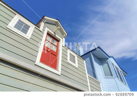 Houses with gray and blue wood vinyl sidings in San Francisco, California 92889709