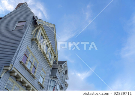 Low angle view of a townhouse with queen anne victorian style in San Francisco, California 92889711