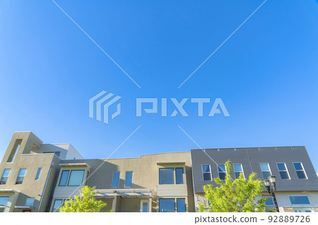 Exterior of a complex building in a low angle view at Daybreak in South Jordan, Utah 92889726