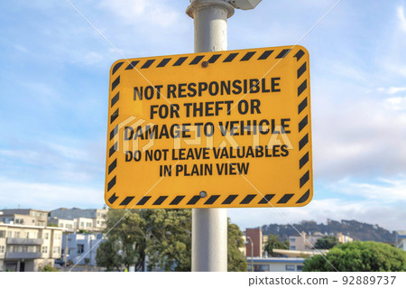 Yellow warning sign on a post in San Francisco, California Yellow warning sign on a post in San Francisco, California 92889737