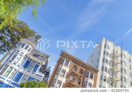 Slanted low angle view of three multi-storey residential buildings in San Francisco, California Slanted low angle view of three multi-storey residential buildings in San Francisco, California 92889793