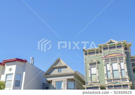 Low angle view of houses with different designs against the clear sky in San Francisco, California Low angle view of houses with different designs against the clear sky in San Francisco, California 92889920