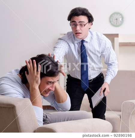 Young male patient discussing with psychologist personal problem Young male patient discussing with psychologist personal problem 92890198