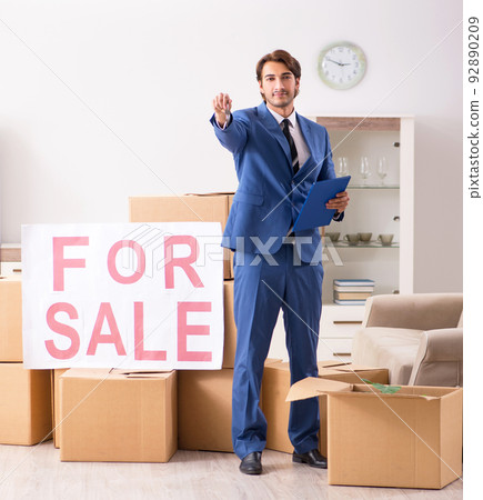The young handsome realtor selling flat The young handsome realtor selling flat 92890209