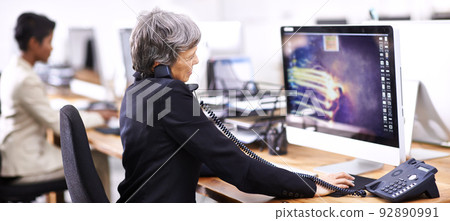 Just another busy day in the office. Cropped shot of two businesswomen working in an office. 92890991