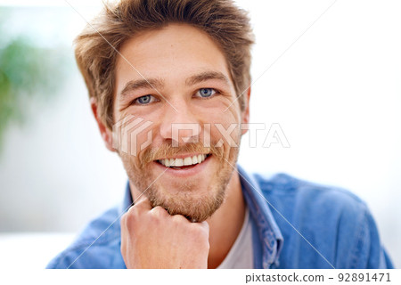 Now thats a smile. Portrait of a handsome young man. 92891471