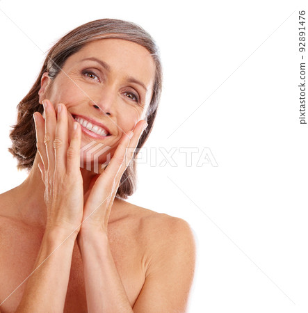 My skin still feels great. Studio portrait of a beautiful mature woman posing against a white background. My skin still feels great. Studio portrait of a beautiful mature woman posing against a white background. 92891476