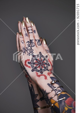 Creative self-expression. A cropped shot of tattooed hands. Creative self-expression. A cropped shot of tattooed hands. 92891715
