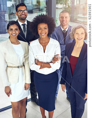 Teamwork enables smoother movement towards targets. Portrait of a team of corporates standing together in an office. 92891901