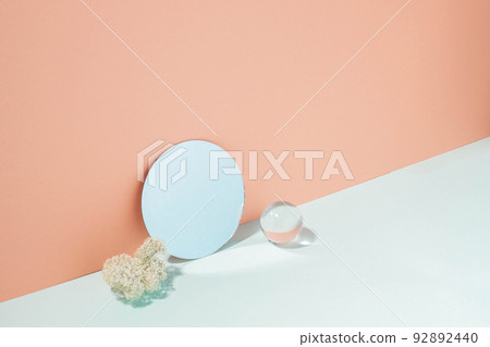Creative minimalistic podium background various materials, glass mirror, blue coral pastel background Creative minimalistic podium background various materials, glass mirror, blue coral pastel background 92892440