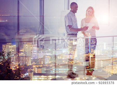 She needs his signature. Multiple exposure shot of a city skyline superimposed on businesspeople talking. She needs his signature. Multiple exposure shot of a city skyline superimposed on businesspeople talking. 92893378