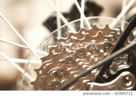 Lets switch into high gear. Closeup shot of a bicycles rear wheel. Lets switch into high gear. Closeup shot of a bicycles rear wheel. 92894711