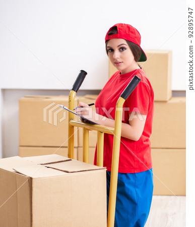 Young female professional mover doing home relocation Young female professional mover doing home relocation 92895747