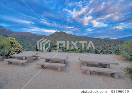 Three concrete dining tables on campgrounds of Sabino Canyon State Park in Tucson, Arizona Three concrete dining tables on campgrounds of Sabino Canyon State Park in Tucson, Arizona 92896029
