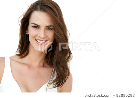 Nothing makes me more beautiful than believing I am. Studio portrait of an attractive young woman posing against a white background. Nothing makes me more beautiful than believing I am. Studio portrait of an attractive young woman posing against a white background. 92896298