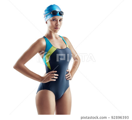 Focussed on swimming. Cropped portrait of a young female swimmer isolated on white. Focussed on swimming. Cropped portrait of a young female swimmer isolated on white. 92896393