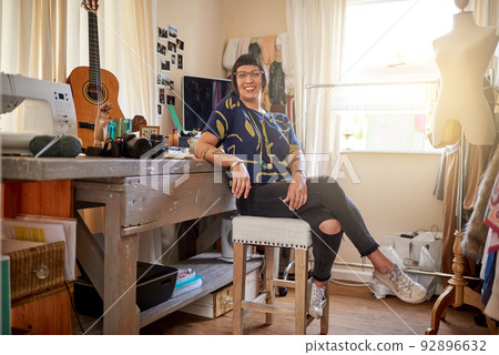 Its my creative space. Portrait of a stylish young designer sitting in her eclectic studio. 92896632