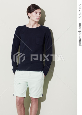 Elegant male features. A handsome young man with elegant facial features posing for a studio shoot. Elegant male features. A handsome young man with elegant facial features posing for a studio shoot. 92896709