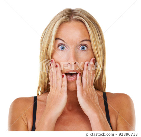 I cant believe it. Portrait of a beautiful blonde looking shocked. 92896718