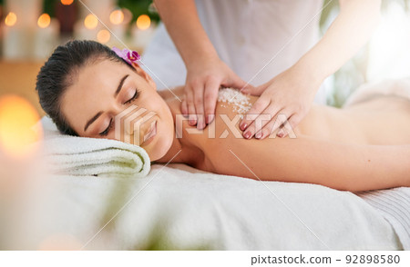 This is my kind of indulgence. Cropped shot of an attractive young woman getting an exfoliating treatment at the spa. This is my kind of indulgence. Cropped shot of an attractive young woman getting an exfoliating treatment at the spa. 92898580