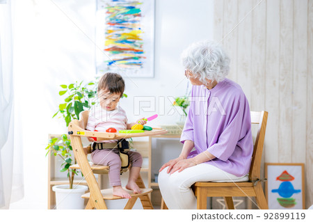 grandma taking care of grandchildren grandma taking care of grandchildren 92899119