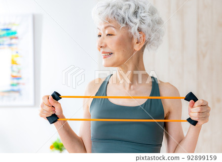 Senior woman doing muscle training Senior woman doing muscle training 92899159