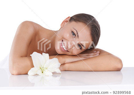 Her radiant beauty is the product of great skincare. Cropped shot of a beautiful young woman isolated on white. 92899568